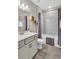 Bathroom with a shower-tub combo and modern fixtures, perfect for everyday convenience and style at 15954 Winding Bluff Dr, Montverde, FL 34756