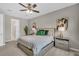 Relaxing bedroom featuring a ceiling fan, neutral color palette and comfortable, modern decor at 15954 Winding Bluff Dr, Montverde, FL 34756