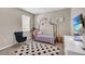 Charming bedroom featuring a canopy bed, adding a whimsical touch to the room at 15954 Winding Bluff Dr, Montverde, FL 34756