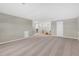 Expansive bonus room with neutral carpeting, recessed lighting, and ample space for various activities at 15954 Winding Bluff Dr, Montverde, FL 34756