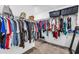 Large walk-in closet with ample shelving and storage space for all of your wardrobe needs at 15954 Winding Bluff Dr, Montverde, FL 34756