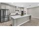 Spacious kitchen with a large center island, stainless steel appliances, and ample cabinet space at 15954 Winding Bluff Dr, Montverde, FL 34756