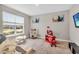 Playroom filled with toys, a kitchen set and a slide, offering a fun space for  at 15954 Winding Bluff Dr, Montverde, FL 34756