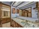 Bathroom featuring wood cabinetry, a patterned countertop, and a large mirror at 161 Cindy Ct, Lake Mary, FL 32746