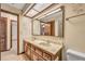 Bathroom with dual sinks, tile floors, and floral wall decorations at 161 Cindy Ct, Lake Mary, FL 32746