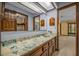 Bathroom featuring a sink with a patterned countertop and a large mirror at 161 Cindy Ct, Lake Mary, FL 32746