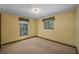 Bedroom with carpeted floors and two windows featuring patterned valances at 161 Cindy Ct, Lake Mary, FL 32746
