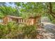 Charming home exterior with stone and wood details and screened-in pool at 161 Cindy Ct, Lake Mary, FL 32746