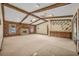 Spacious living room with wood beam ceiling, stone fireplace, and built-in wet bar at 161 Cindy Ct, Lake Mary, FL 32746