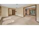 Open concept living space with doorways to other rooms and access to outdoor patio through sliding glass door at 161 Cindy Ct, Lake Mary, FL 32746