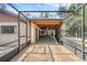 A view of the spacious screened-in patio from the gravel area at 161 Cindy Ct, Lake Mary, FL 32746
