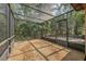 Screened porch with pea gravel and a view of the surrounding foliage at 161 Cindy Ct, Lake Mary, FL 32746