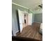 Bedroom featuring vinyl floors and doors to another room at 1626 Cypress Pt, Lady Lake, FL 32159
