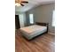 Cozy bedroom with wood laminate flooring, closet space and natural light at 1626 Cypress Pt, Lady Lake, FL 32159