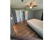 Bedroom with wood laminate flooring and easy access to the rest of the home at 1626 Cypress Pt, Lady Lake, FL 32159