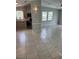 Open concept kitchen featuring stainless steel appliances, and access to the living room at 1626 Cypress Pt, Lady Lake, FL 32159