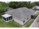 Backyard view with a screened-in porch at 1730 Dorset Dr, Mount Dora, FL 32757
