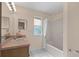 Bathroom featuring a shower, vanity, and tile flooring at 1730 Dorset Dr, Mount Dora, FL 32757