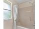 Bathroom featuring a shower with a white curtain at 1730 Dorset Dr, Mount Dora, FL 32757