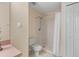 Bathroom featuring a shower, toilet, and tile flooring at 1730 Dorset Dr, Mount Dora, FL 32757