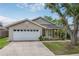 Charming single-story home with a garage and well-maintained lawn at 1730 Dorset Dr, Mount Dora, FL 32757