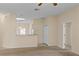 Inviting living room showcasing an open layout, neutral tones, and seamless transition to the adjoining kitchen at 1730 Dorset Dr, Mount Dora, FL 32757