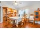 Traditional dining room with hardwood floors, a hutch and natural light at 17428 Woodfair Dr, Clermont, FL 34711