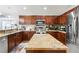 Kitchen has stainless appliances, granite countertops and dark cabinets at 17428 Woodfair Dr, Clermont, FL 34711
