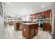 Bright kitchen features an island, stainless appliances, and beautiful countertops at 17428 Woodfair Dr, Clermont, FL 34711