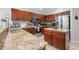 This kitchen has stainless appliances and granite countertops at 17428 Woodfair Dr, Clermont, FL 34711
