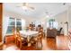 Open-concept living and dining area with hardwood floors at 17428 Woodfair Dr, Clermont, FL 34711