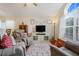 Inviting living room with a decorative rug and plenty of natural light at 17428 Woodfair Dr, Clermont, FL 34711