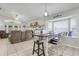 Open-concept living and dining area with ample natural light and comfortable seating at 17428 Woodfair Dr, Clermont, FL 34711