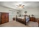 Cozy bedroom with natural light, carpet and wooden furniture at 17533 Se 96Th Ct, Summerfield, FL 34491