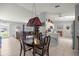Open-concept dining area adjacent to the kitchen, creating a spacious and inviting atmosphere at 17533 Se 96Th Ct, Summerfield, FL 34491
