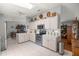 Bright kitchen with white cabinets, stainless steel appliances, and tile flooring at 17533 Se 96Th Ct, Summerfield, FL 34491