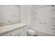 Full bathroom featuring a vanity with a solid surface countertop and a shower-tub combo at 1964 Rhett Rd, The Villages, FL 32163
