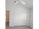 Bedroom featuring closet and door at 1964 Rhett Rd, The Villages, FL 32163