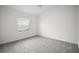 Spacious bedroom with new carpet, ceiling fan, fresh paint and natural light at 1964 Rhett Rd, The Villages, FL 32163