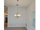 Dining room features a chandelier and kitchen at 1964 Rhett Rd, The Villages, FL 32163