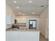 Bright kitchen features stainless steel appliances and a breakfast bar at 1964 Rhett Rd, The Villages, FL 32163
