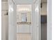 Bathroom featuring a double sink vanity with white cabinets and a shared mirror with lighting at 219 Carrera Dr, The Villages, FL 32159
