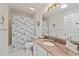 Bathroom featuring a shower/tub combination, vanity with granite counters, and ample lighting at 219 Carrera Dr, The Villages, FL 32159