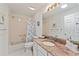 Bathroom with shower and tub combination, granite counter tops, and white cabinets at 219 Carrera Dr, The Villages, FL 32159