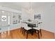 Chic dining room with elegant chandelier, seating for six, and modern decor for stylish meals at 219 Carrera Dr, The Villages, FL 32159