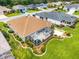Charming home featuring a screened-in pool, patio, and well-maintained landscaping at 219 Carrera Dr, The Villages, FL 32159