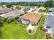 A lovely home featuring a screened-in pool, well-manicured landscaping, and a serene outdoor space at 219 Carrera Dr, The Villages, FL 32159