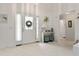 Bright foyer with tiled floors, a decorated front door, and stylish furnishings at 219 Carrera Dr, The Villages, FL 32159