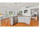 Modern kitchen with granite countertops and stainless steel appliances and a breakfast nook at 219 Carrera Dr, The Villages, FL 32159