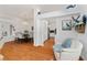 Bright and airy living space with hardwood floors connects kitchen and dining for open-concept living at 219 Carrera Dr, The Villages, FL 32159